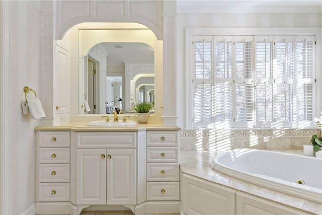 full bathroom featuring plenty of natural light, crown molding, vanity, and a jetted tub