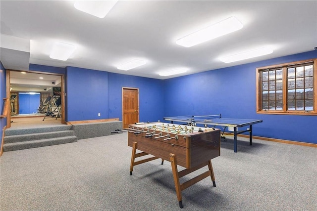 recreation room featuring carpet flooring and baseboards