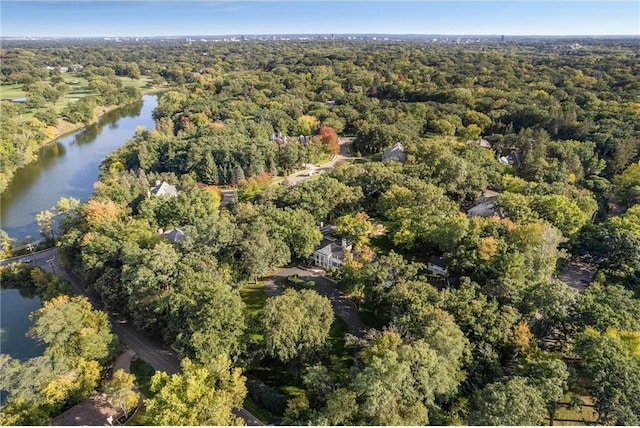 aerial view featuring a water view and a view of trees