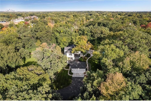 drone / aerial view featuring a view of trees