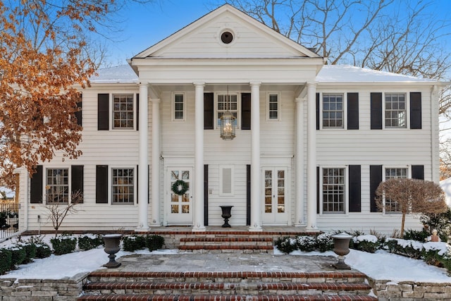 greek revival inspired property with covered porch