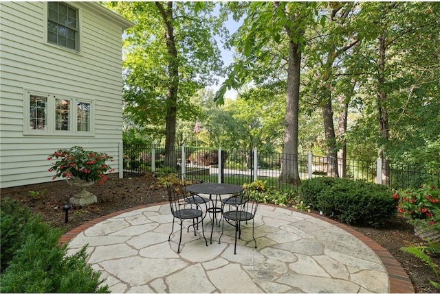 view of patio / terrace featuring fence and outdoor dining space