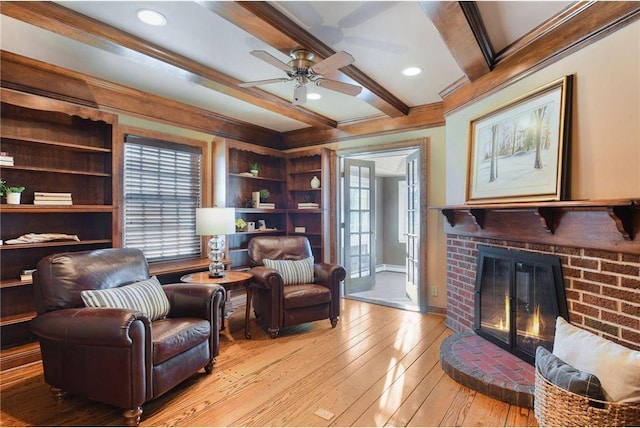 6321 Interlachen Blvd, Edina, MN 55436 - sitting room with light wood-type flooring, a fireplace, crown molding, ceiling fan, and a wealth of natural light
