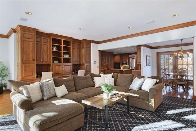 6321 Interlachen Blvd, Edina, MN 55436 - living room with wood finished floors, a notable chandelier, crown molding, visible vents, and recessed lighting