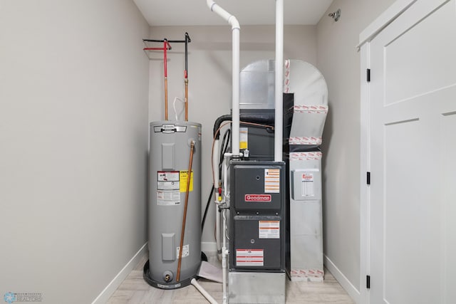 utility room featuring water heater