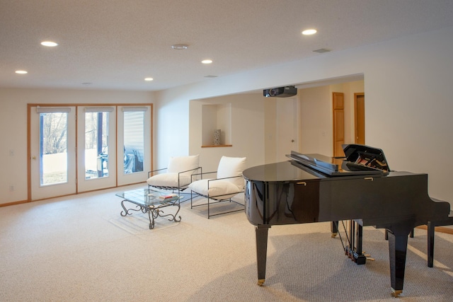 sitting room with carpet flooring, recessed lighting, and baseboards