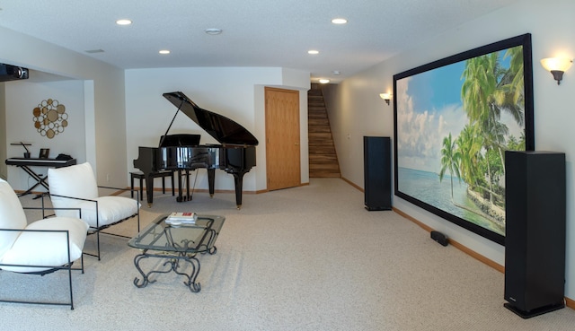 sitting room with stairway, recessed lighting, light colored carpet, and baseboards