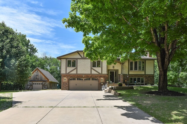 4879 Mayelin Ave NE, Saint Michael, MN 55376 - view of front of property with stucco siding, an attached garage, driveway, and a front lawn