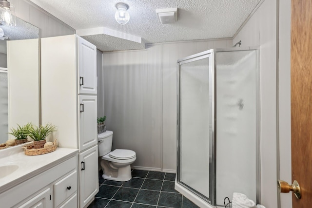 full bath with a textured ceiling, tile patterned flooring, a shower stall, and toilet