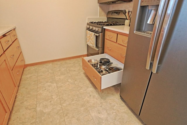 kitchen featuring stainless steel appliances and light tile patterned floors