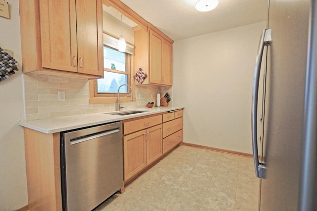 kitchen with light brown cabinetry, dishwasher, sink, decorative backsplash, and hanging light fixtures