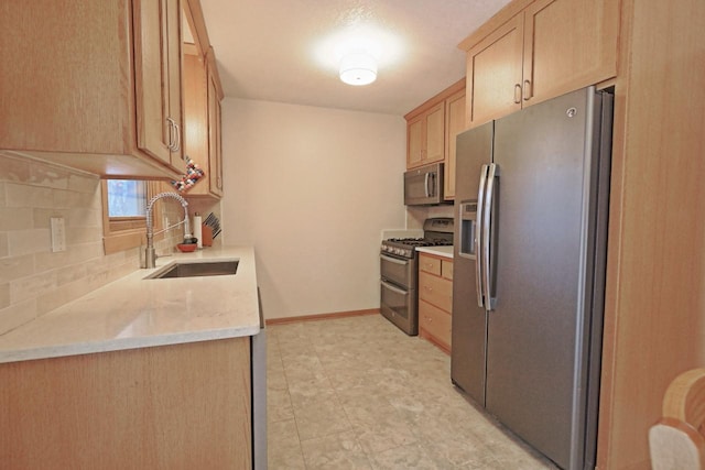 kitchen featuring tasteful backsplash, sink, stainless steel appliances, and light brown cabinets