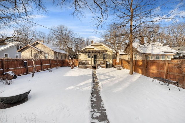 yard layered in snow featuring a deck