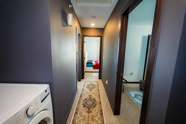 clothes washing area featuring washer / dryer and light carpet