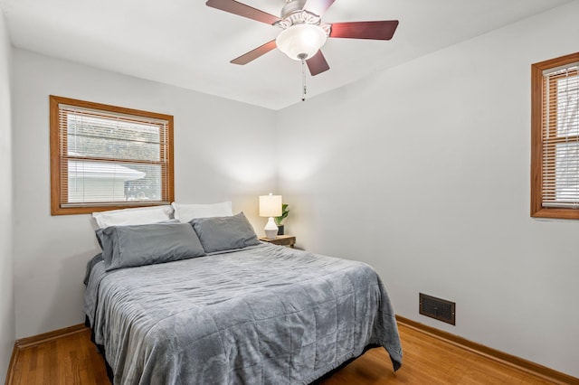 bedroom featuring hardwood / wood-style floors and ceiling fan