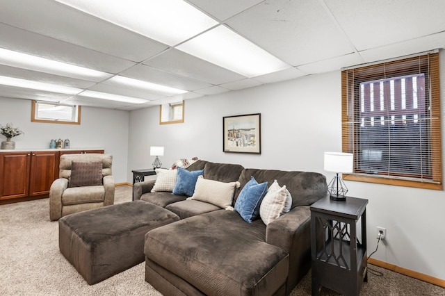 living room with light colored carpet and a paneled ceiling