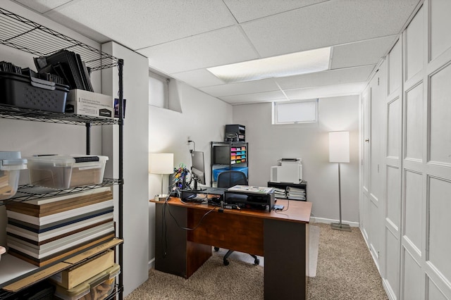 home office with light carpet and a drop ceiling