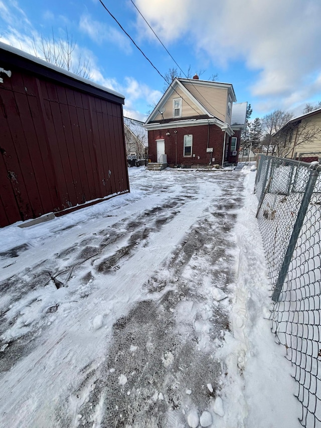 view of yard layered in snow