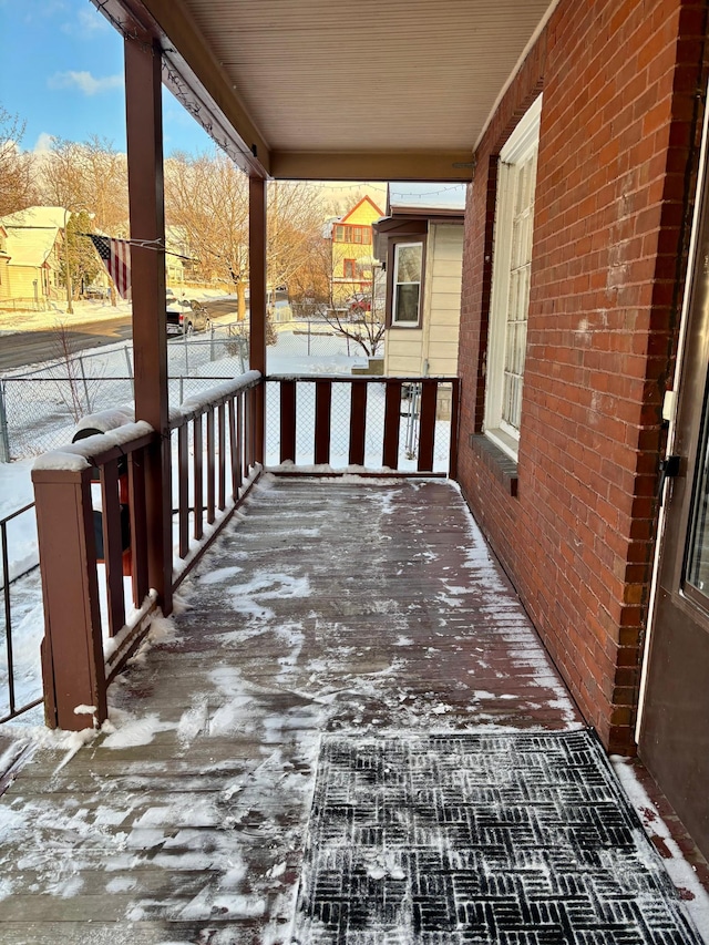 view of snow covered deck