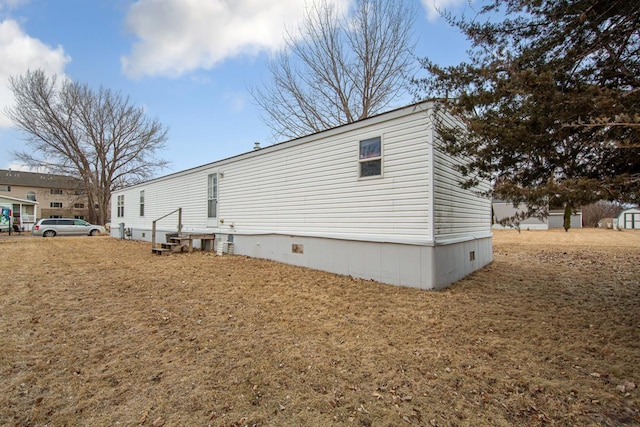 view of home's exterior featuring a lawn