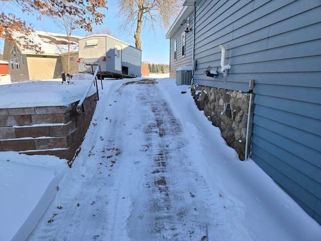 snowy yard with central air condition unit