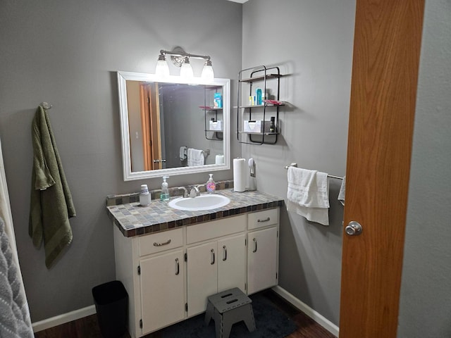 bathroom with vanity and hardwood / wood-style floors