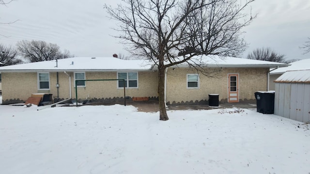 view of snow covered house