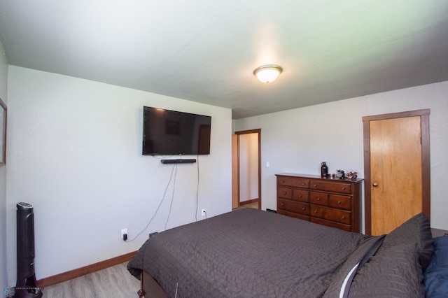 bedroom with light wood-type flooring