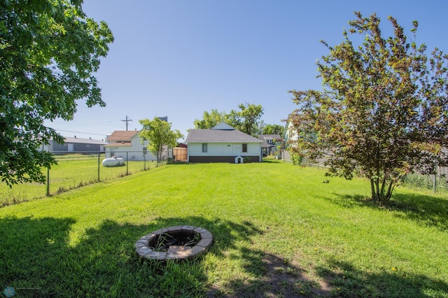 view of yard with an outdoor fire pit