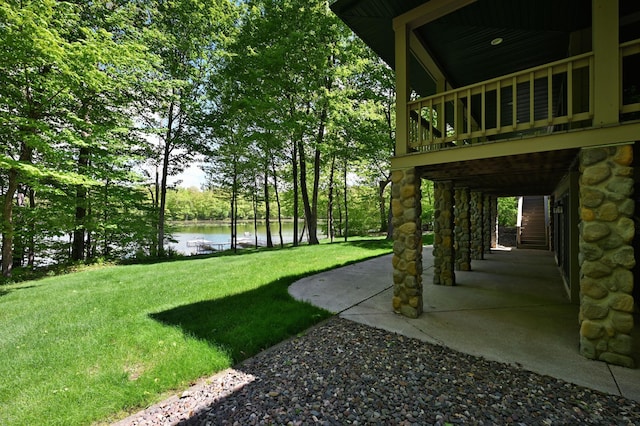 2772 25th Ave Unit B, Cedar Lake Twp, WI 54868 - view of grassy yard with a patio and a deck with water view