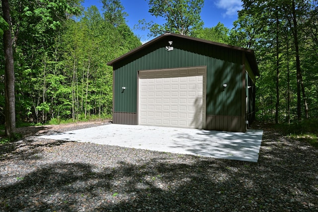 2772 25th Ave Unit B, Cedar Lake Twp, WI 54868 - detached garage with gravel driveway and a wooded view