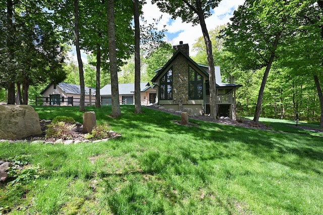 2772 25th Ave Unit B, Cedar Lake Twp, WI 54868 - rear view of property featuring a chimney