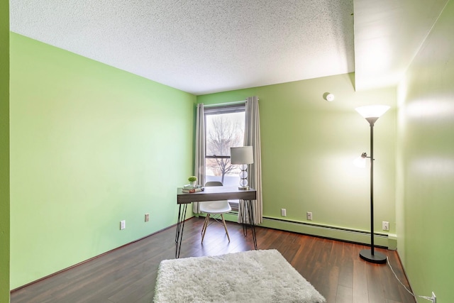 office with dark wood-style floors, a textured ceiling, and baseboard heating