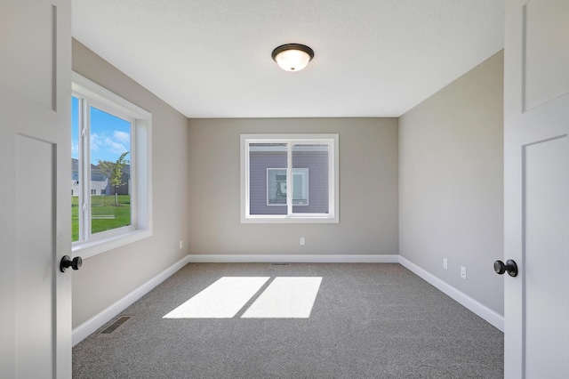 unfurnished room with carpet