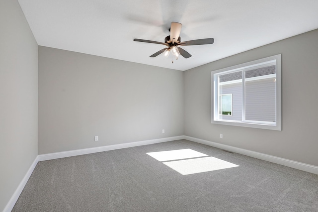 empty room with carpet and ceiling fan