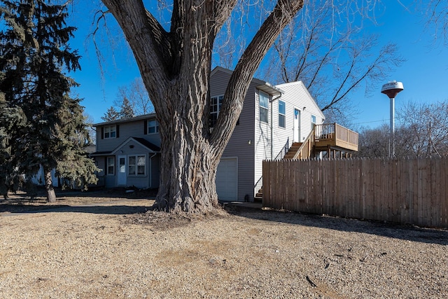 view of front of property with a garage and a deck