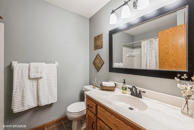 bathroom featuring tile patterned floors, toilet, a textured ceiling, vanity, and curtained shower