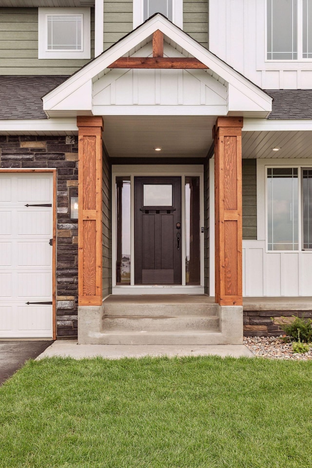 view of exterior entry featuring a garage