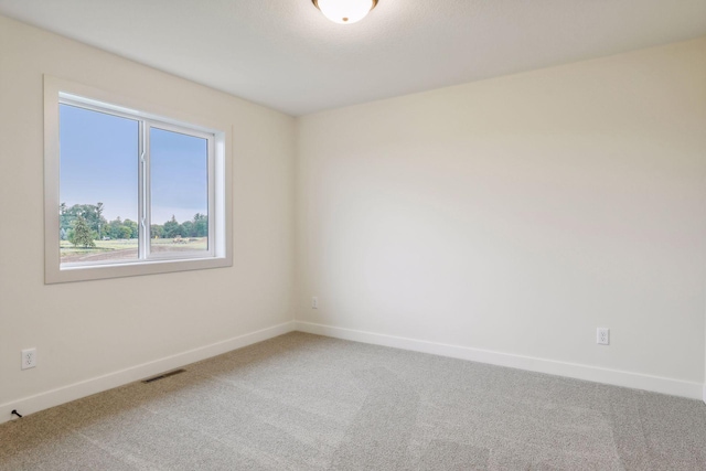 unfurnished room with carpet floors