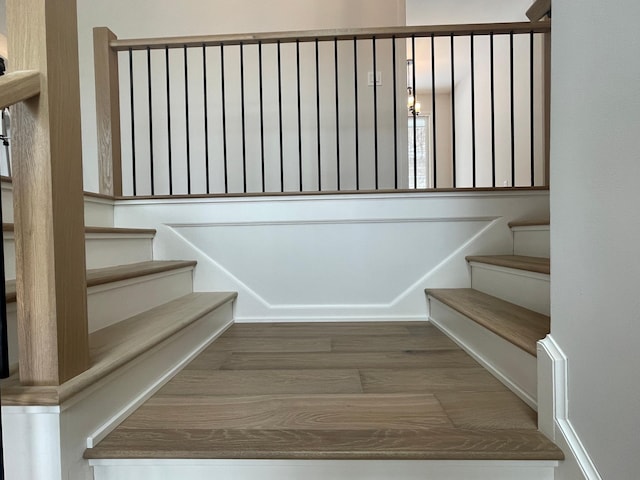 stairway with wood-type flooring