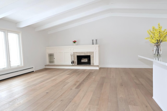 unfurnished living room featuring vaulted ceiling with beams, light hardwood / wood-style flooring, a fireplace, and a baseboard radiator