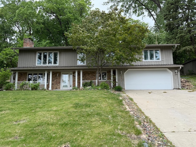 2611 Kyle Ave N, Golden Valley, MN 55422 - traditional-style house featuring covered porch, driveway, a chimney, and a front lawn