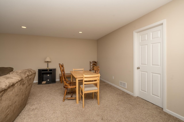 view of carpeted dining space