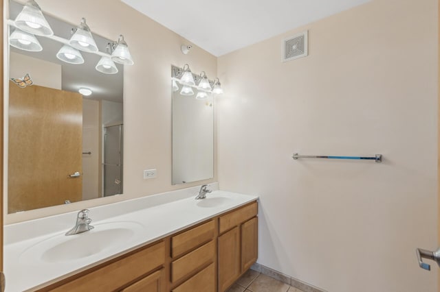 bathroom with vanity and tile patterned flooring