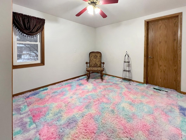 living area featuring ceiling fan