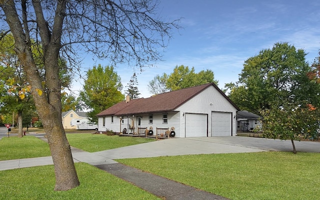 view of front of home featuring a garage and a front yard