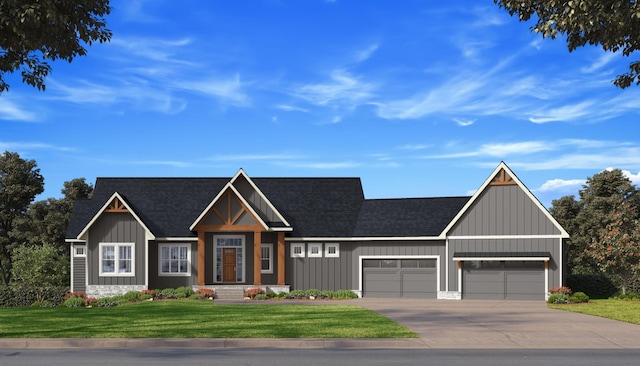 view of front of home featuring a garage and a front lawn