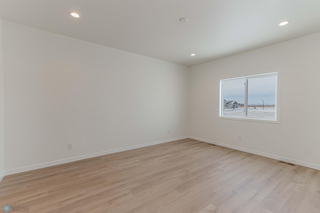 empty room featuring light hardwood / wood-style floors