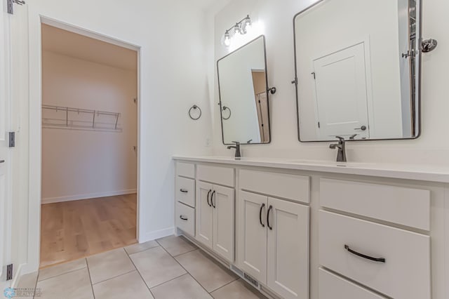 bathroom with vanity and tile patterned floors