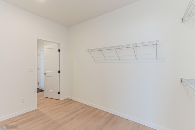 spacious closet featuring light hardwood / wood-style flooring